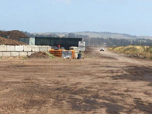 Green waste and yard waste unloading spot, which is just beyond the large pile of yard waste.