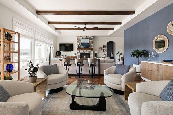 Beautful and serene family room with blue accent wall and inviting warm wood tones.
