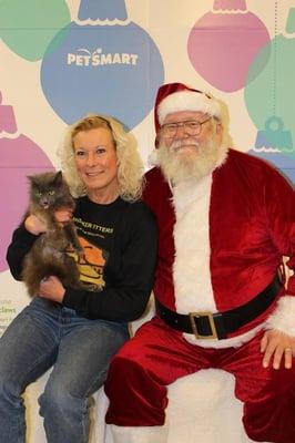 Carol Preuett, owner/operator of Whisker Sitters with Santa Claws at AC PAW dog & cat rescue fundraiser in Traverse City.