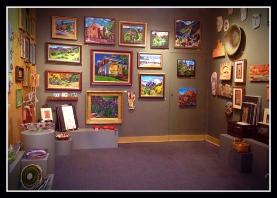 Some of the captivating paintings of local scenes at Green Horse Gallery.