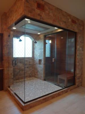 Contained within a twelve foot square glass box this uber shower features electronic controls, dual shower heads and a Califo...
