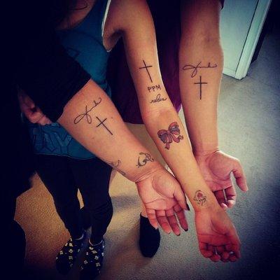 Signature/initials and a cross