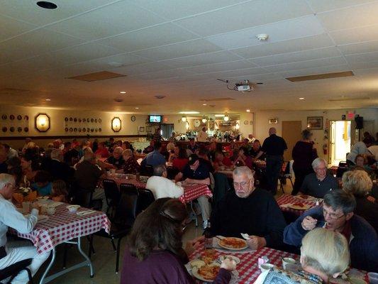 Attending a spaghetti dinner fundraiser for ALS