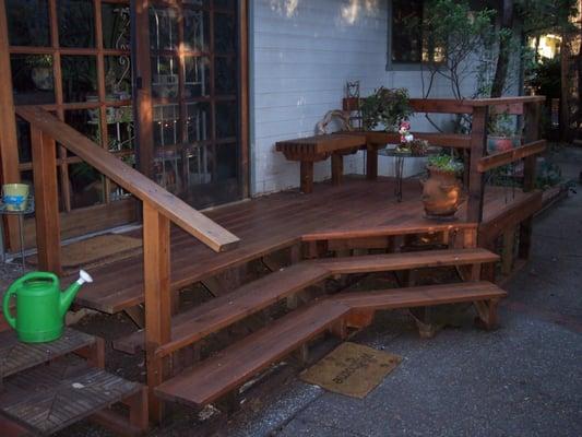 Owner had an unusable 3 x 4 landing and steps. This low cost addition created an intimate seating area overlooking the back gardens.