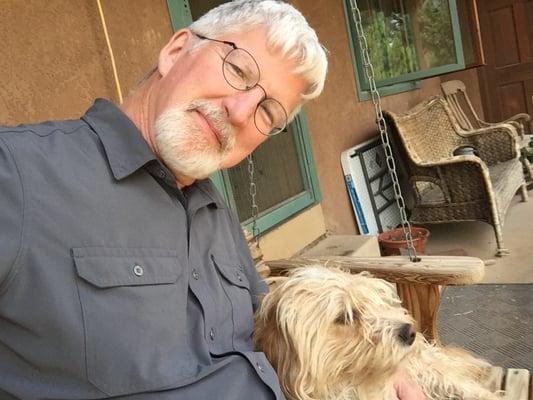 John, of John's Pet & Home Care, with contented client.