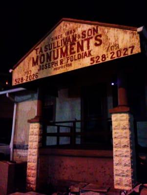 T.A. Sullivan & Son Monuments at night.