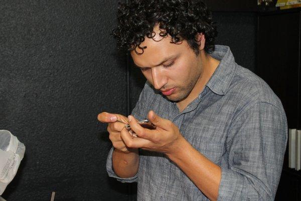 Technician testing functions after fixing an iPhone 7 Plus