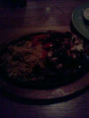 Fajitas!!!! Sorry but it is dark in here. The portion is good and they tasted decent.