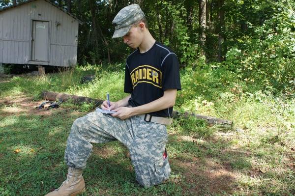 Here is a cadet tracking raider scores at practice.