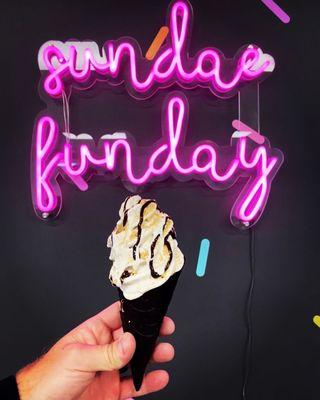 That-smore-ay. Vanilla ice cream with graham cracker crumbles, chocolate syrup and marshmallow sauce in a black vanilla cone.