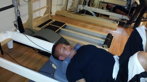 Fellow client, having his reformer session, great for body builders to reduce soreness and increase flexibility.