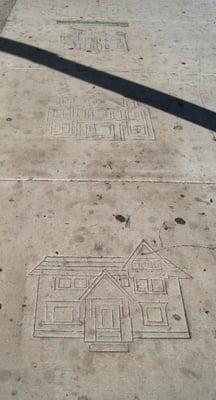 row of victorian houses etched into sidewalk...