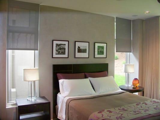 Smooth, silent Lutron automated shades in designer bedroom.