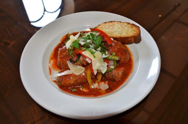 Meatballs and Sausage - Homemade meatballs and mild Italian sausage topped with roasted peppers and onions in our red sauce.