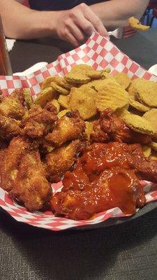 Medium wings with pickle chips. Lemon pepper, good but a bit salty Chipotle maple the best Carib jerk lives up to the spicy.