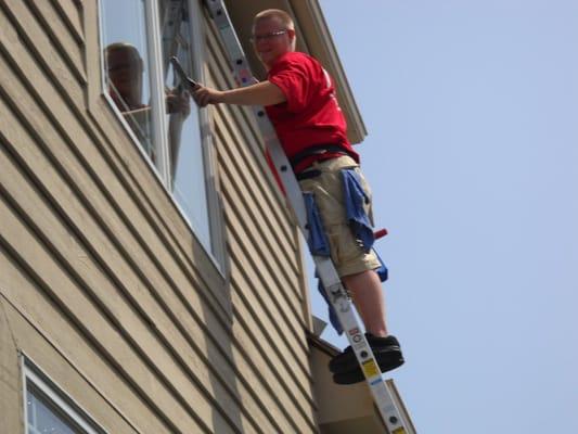 Fish cleaning 2nd story residential windows