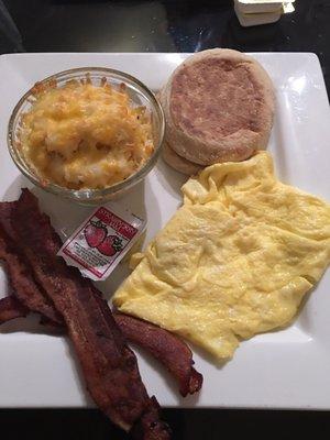 Chezy has brown casserole, eggs, bacon, English muff.