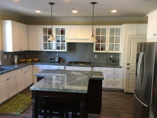 Kitchen cabinets refinished with white polyurethane, the island finished with urethane oil based enriched gel-stain and protected with polyu
