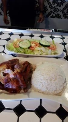 Pollo ala Brasa rice and salad. Moist delicious chicken, the salad dressing is terminal.