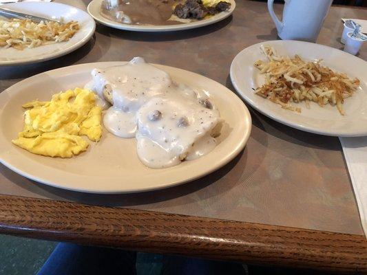 Scrambled eggs, gravy biscuit and hash browns