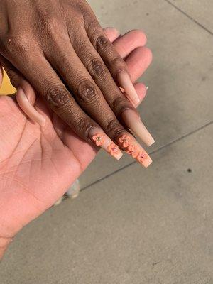Long tapered square nails, with orange chrome powder and orange 3D flowers