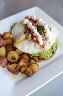 Avocado Toast with Egg and Pico de Gallo alongside Esta's potatoes