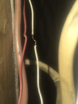 Dangerous wires hanging off side of furnace easily accessible to children