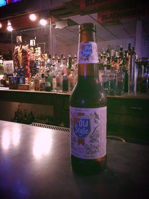 Cold Old Style bottle on the bar. Liquor also available. Cash only.