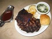 Barbecue ribs and ribeye with sauteed spinach and baked potato casserole