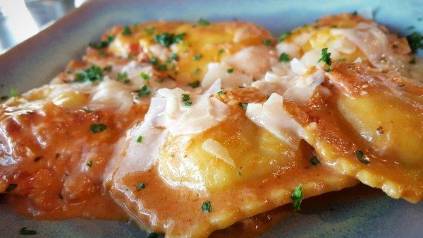 Lobster Ravioli- Ravioli filled with lobster meat in a sherry cream reduction. Served with crab cognac cream sauce.