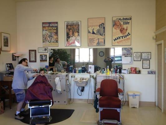 Ray cutting his newest clients hair.