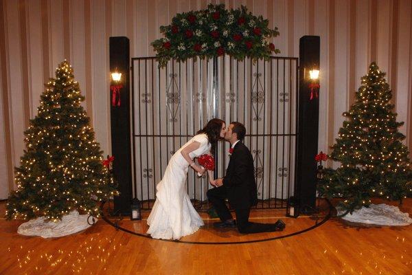 Young couple in front of decorative gate