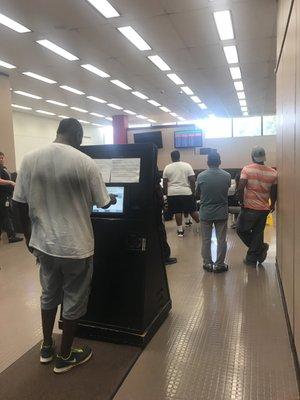 Sign in kiosk to get in line then wait