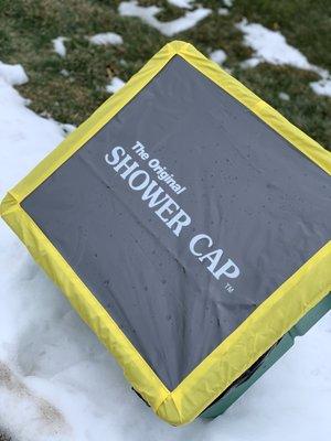 A shower cap fertilizer cover for a spreader that landscapers use. Turf Products--Home of the Original Shower Cap.