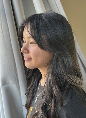 My daughter after her haircut and running around on a windy day.