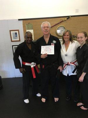 Sensei Mark Madison receiving his NiDan certificate of rank.