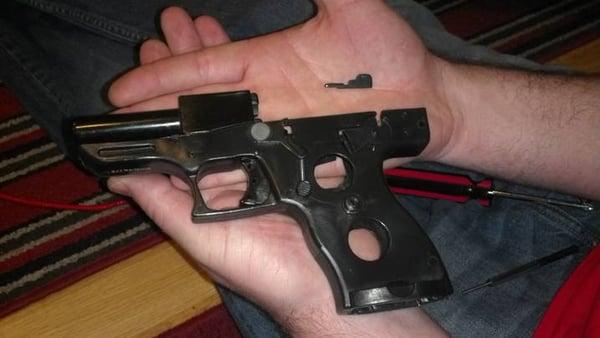 The piece that fell out of our gun before we took it apart and put it back together to make it work properly