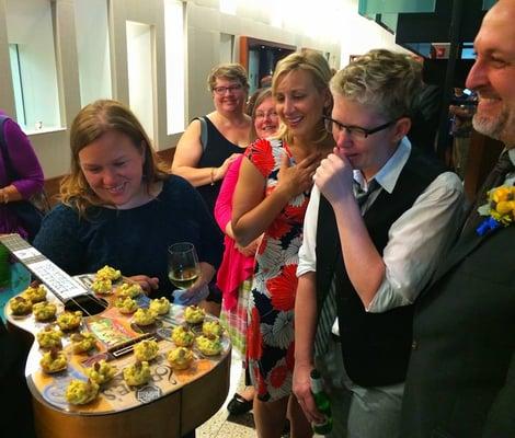 Guests admiring Truffleberry's Mac and Cheese appetizers on the custom guitar