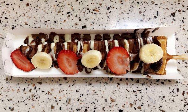 Waffle on a stick with chocolate sauces &fruits