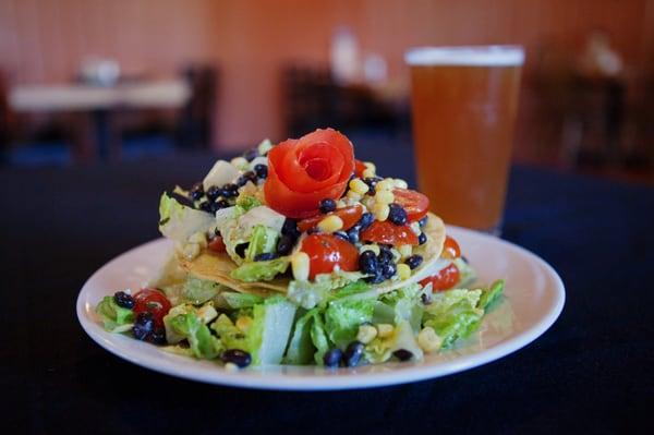 Tower of Cezar: Romaine, corn & black beans tossed with cezar dressing and layered between corn tortillas. Pulled pork added.