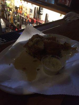 Fried pickles clumped together laying in a bed of grease. Why anyone would serve this to a customer is beyond me. FAIL