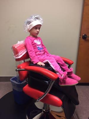 Watching tv while I hair is being treated