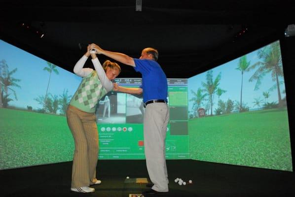 Randy Henry Giving a lesson on his aboutGolf PGA Tour Simulator