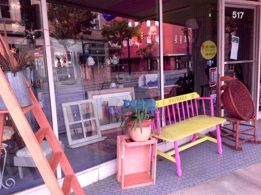 We are easy to find! Just look for the pink and green bench out front!