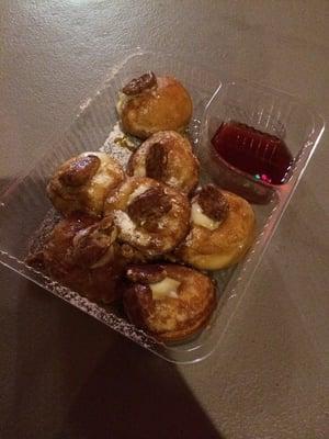 Skivers-Scandinavian pancake balls, filled with oj citrus cream cheese with pecan topping and extra strawberry syrup on the side