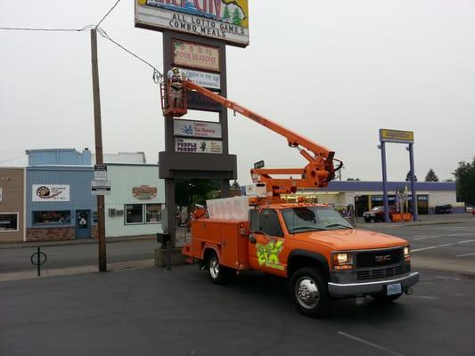 Hanging a Sign on 6th street in Grants pass.