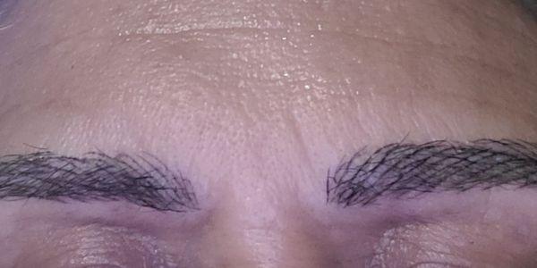 Completely crooked and uneven and black, which I was very clear, and she still did them black, horrible symmetry