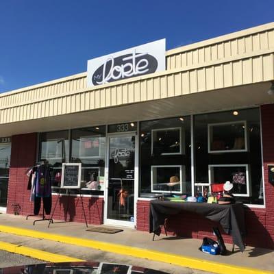 The front of the store with its discounted items outside on this pretty day.