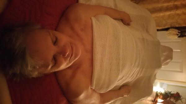 Relaxing on sound table with Amethyst Biomat infra-Red Heat