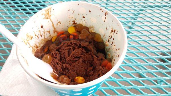 Chocolate shaved ice with mango bobas and Reeses pieces and Ghirardelli chocolate drizzle Owner Troy.